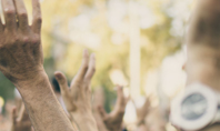 Raised Hands of Protesters at Political Demonstration Presentation Presentation Template