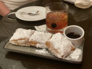 beignets and cocktails in new orleans