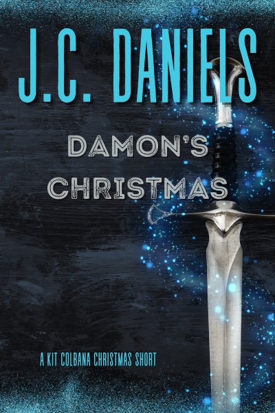 Shows a sword against a gray background with swirling blue elements that give it a magical appeal. Title: Damon's Christmas, A Kit Colbana World Short