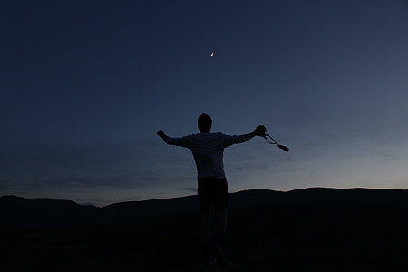 silhouette of man during night time