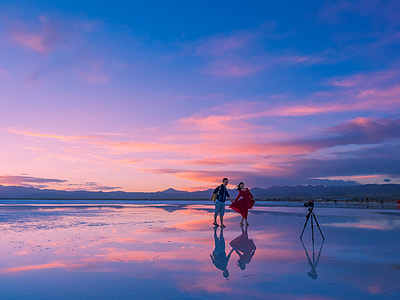 man and woman talking photo in the sea