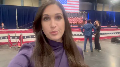 Nada Tawfik in front of a podium