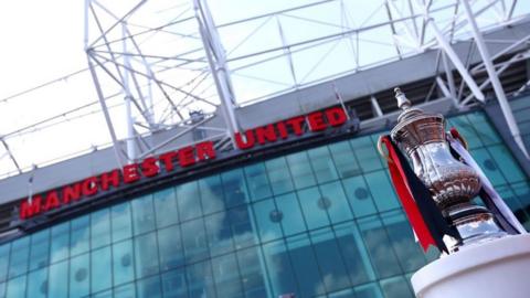 A picture of the outside of Old Trafford