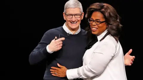 Reuters Apple chief executive Tim Cook and Oprah Winfrey