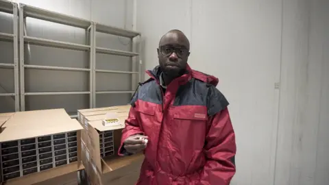 Correspondent Ian Wafula in a cold storage facility for mpox vaccines in Kinshasa, DRC.