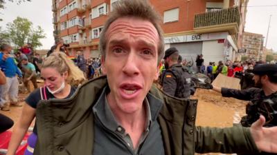 The BBC's Mark Lowen stands amidst scenes of chaos and flooding damage in Paiporta, the worst hit suburb of Valencia