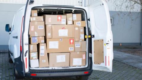 White van filled with parcels