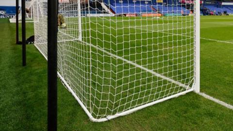 The bottom corner of a net at a National League ground