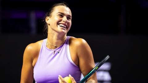 Aryna Sabalenka laughs during practice at the WTA Finals in Saudi Arabia