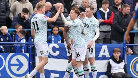 Mansfield Town celebrate scoring against Curzon Ashton in the FA Cup 