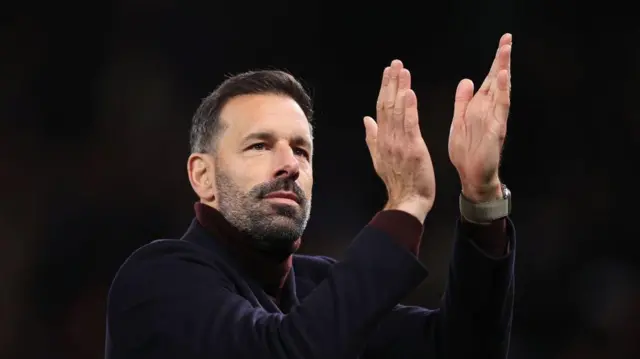 Manchester United interim manager Ruud van Nistelrooy applauds the support after the Premier League match between Manchester United FC and Chelsea FC at Old Trafford