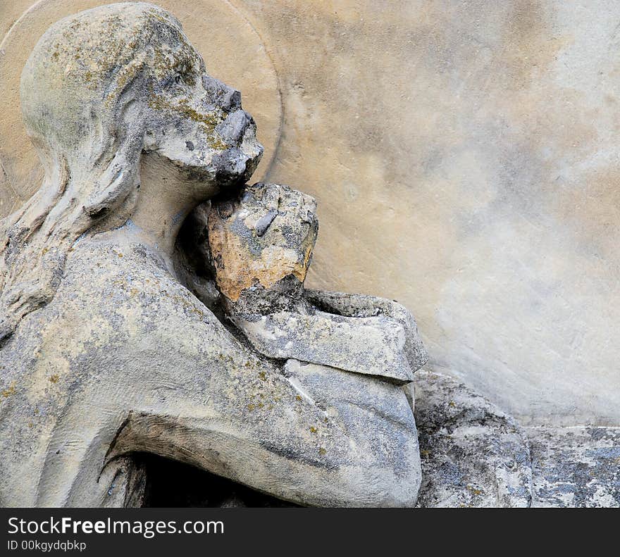 Old Jesus statue in cemetery