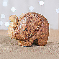 Wood figurine, 'Tiny Kindness' - Handmade Natural Brown Baby Elephant Raintree Wood Figurine