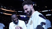 Golden State Warriors teammates Draymond Green and Klay Thompson receive their championship rings in 2022.