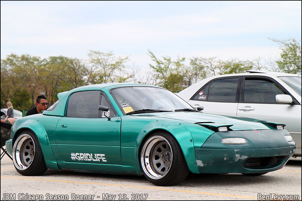 Green Mazda Miata with overfenders