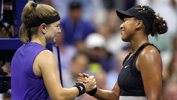 Karolina Muchova (L) of Czech Republic shakes hands with Naomi Osaka after the match