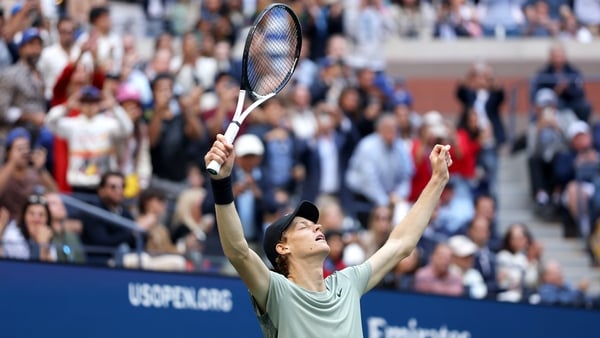 Jannik Sinner celebrates after clinching the title