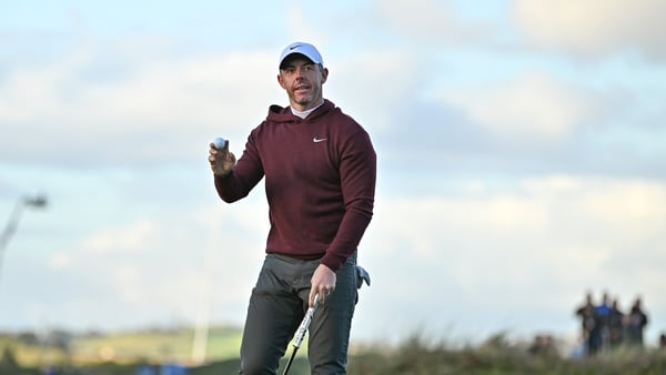 Rory McIlroy salutes the crowd after his closing birdie