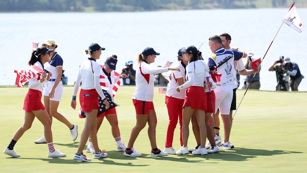 United States players celebrate their Solheim Cup win at Robert Trent Jones Golf Club