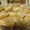 Plate piled with delicious looking lemon coconut squares.