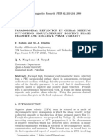 Paraboloidal Reflector in Chiral Medium Supporting Simultaneously Positive Phase Velocity and Negative Phase Velocity