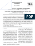 A Model For Stresses, Crack Generation and Fracture Toughness Calculation in Scratched Tin-Coated Steel Surfaces