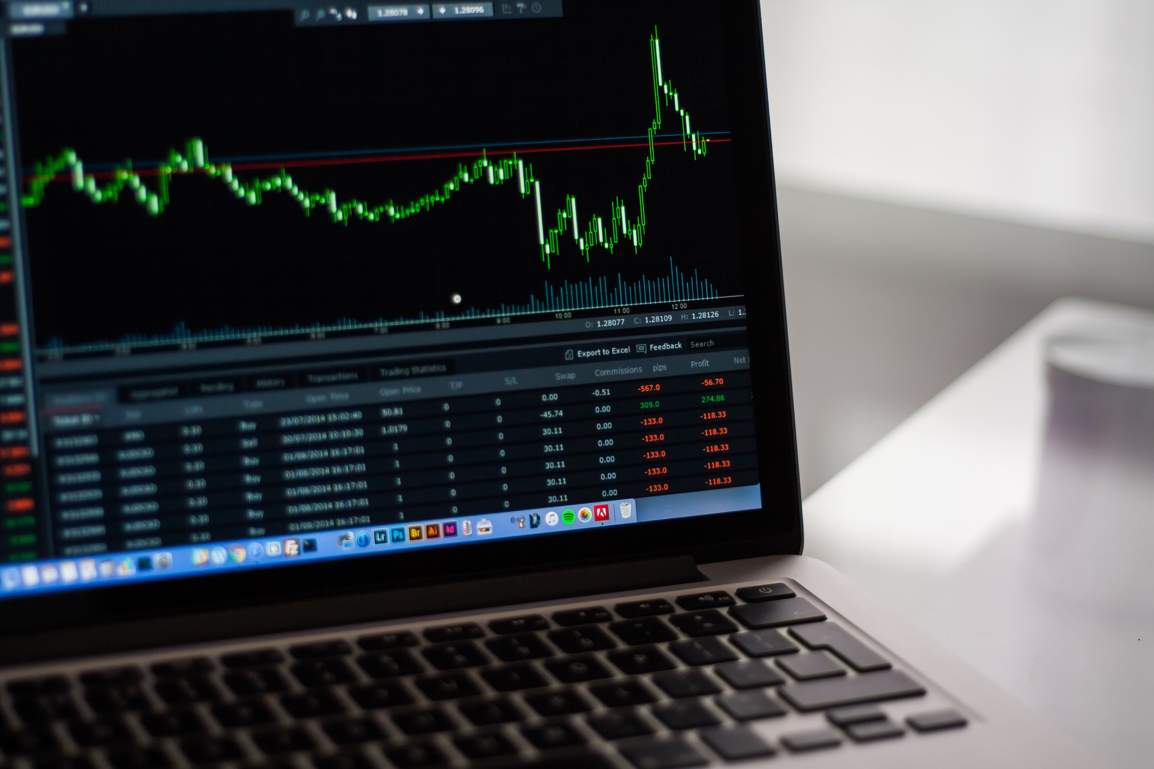 Black laptop computer showing stock graph photo