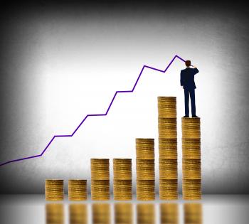 Businessman drawing a finance graph