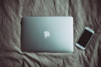 Silver Macbook Beside Silver Iphone 6