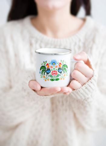 Photo of a Person Holding a Cup