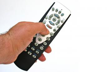 remote control in hand isolated