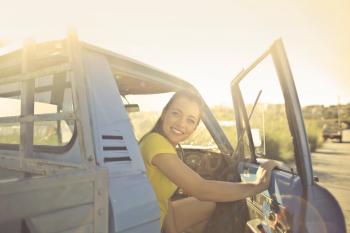 Woman Peeking Inside the Pickup Truck