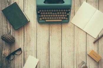 Type writer on wooden table