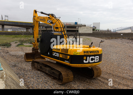 Brighton beach JCB digger Stock Photo