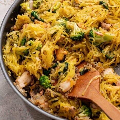 A skillet of seafood spaghetti squash.