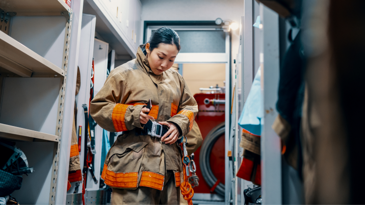 A firefighter preparing for their shift 