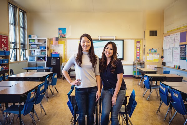 Founder of education tech nonprofit TalkingPoints Heejae Lim and Google.org Fellow Fiona Yeung stand in an empty classroom