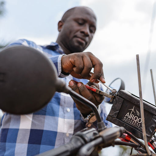 The team installing a sensor on a motorbike known as a boda boda