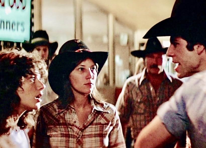 John Travolta, Debra Winger, James Gammon, and Jessie Mapes in Urban Cowboy (1980)