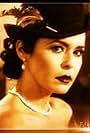 Maria Conchita Alonso in Dillinger in Paradise (1999)