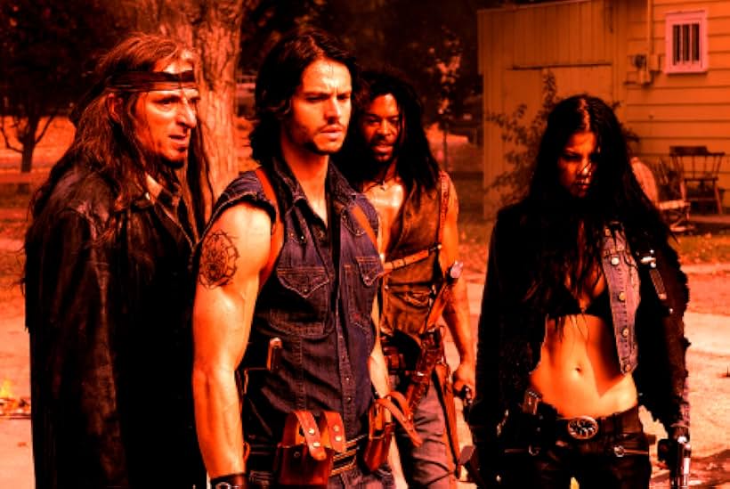 Jason Behr, Kim Coates, Rogue Johnston, and Natassia Malthe in Skinwalkers (2006)