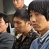 Won Bin, Jin Goo, and Yun Je-mun in Madeo (2009)