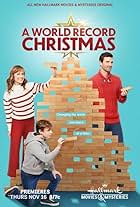 Nikki Deloach, Lucas Bryant, and Aias Dalman in A World Record Christmas (2023)