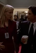 Rob Lowe and Janel Moloney in The West Wing (1999)