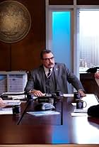 Tom Selleck, Abigail Hawk, Kevin O'Rourke, and Omar Moustafa Ghonim in Where the Truth Lies (2020)