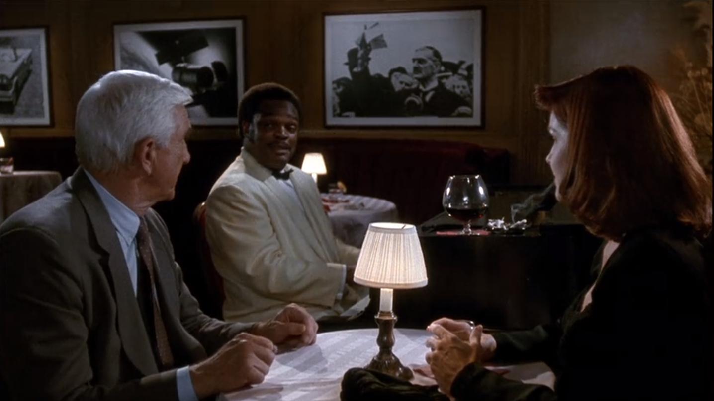 Leslie Nielsen, Priscilla Presley, and James Gilstrap in The Naked Gun 2½: The Smell of Fear (1991)