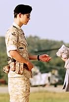 Song Hye-kyo and Song Joong-ki in Descendants of the Sun (2016)