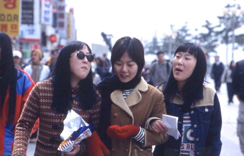 Bae Doona, Eung-sil Lee, and Eung-ju Lee in Take Care of My Cat (2001)