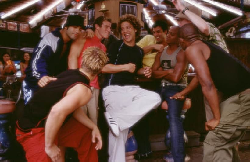 Pals Brandon (Greg Siff, in red shirt), Justin (Justin Guarini), and Eddie (Brian Dietzen, in hat) enjoy Spring Break with new friends played by, left to right, Leo  Moctezuma, Christian George, Travis Payne, and, kneeling, Brandon Henschel  and Kato Bonner.("Brighter Star" song/dance number).