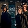 Natalia Dyer, Charlie Heaton, and Joe Keery in Stranger Things (2016)